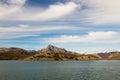 Water reservoir in swamp surrounded by mountains