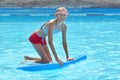 The water rides in the tropics. Girl swims in the water Park.