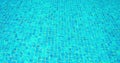 Water ripple in swimming pool. Background blue. Small tiles on the botoom. Close-up static view.