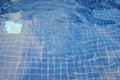 Water ripples on blue tiled swimming pool background. Royalty Free Stock Photo