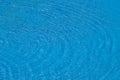 Water ripples on blue tiled swimming pool background. View from above Royalty Free Stock Photo