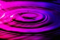 Water ripples on nice purple blue background. Royalty Free Stock Photo