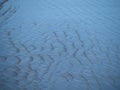 Water ripples on the sandy shore in New Brighton, New Zealand