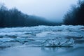 Water in river flowing around large blocks of ice in winter nature Royalty Free Stock Photo