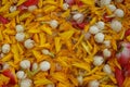 A Water rose petals marigold petals and jasmine flowers in a large bowl. Royalty Free Stock Photo