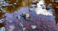 Water running down the river around rocks.