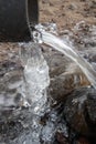 Water running out of plastic pipe at winter Royalty Free Stock Photo