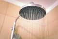 Water running from the shower head in the bathroom, close-up Royalty Free Stock Photo