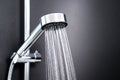 Water running from shower head in bathroom. Royalty Free Stock Photo