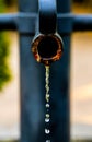 Water running slowly out of a rusted iron pipe Royalty Free Stock Photo