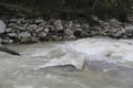 Water rushing in a Himalayan river near the Annapurna range. Nepal