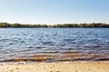 Water\'s edge on the shore. Wave of blue sea on sandy beach