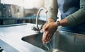 Water, safety and washing hands in the kitchen with a person by the sink for skincare or wellness. Cleaning, hygiene and Royalty Free Stock Photo