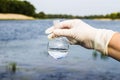 A water sample from the river. Water intake. Water abstraction. Royalty Free Stock Photo