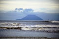 Marine scenery with foggy morning. Sea waves and mountains Silhouette Royalty Free Stock Photo