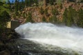 Water shoots from the Button Rock Dam Floodgate in the mountains west of Longmont, Colorado