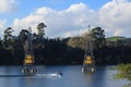 Water skiing and power pylons on Lake Karapiro, New Zealand