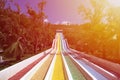 Water slide with bright colored tracks in the aqua park surround Royalty Free Stock Photo