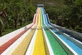 Water slide with bright colored tracks in the aqua park surround Royalty Free Stock Photo