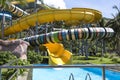 Water slide with bright colored tracks in the aqua park surround Royalty Free Stock Photo