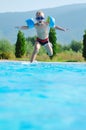 Water slide fun on outdoor pool Royalty Free Stock Photo