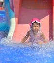 Water slide fun on outdoor pool in summer Royalty Free Stock Photo