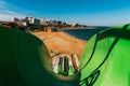 A water slide in an open water park near the sea against the backdrop of Gelendzhik Bay, a first-person view. Gelendzhik, Russia