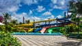 Water slides in tropical aqua park Royalty Free Stock Photo