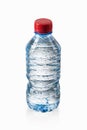 Water. Small plastic water bottle with water drops on white back Royalty Free Stock Photo