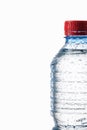 Water. Small plastic water bottle with water drops on white back Royalty Free Stock Photo