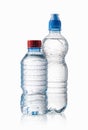 Water. Small plastic water bottles with water drops on white bac Royalty Free Stock Photo