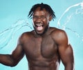 Water splash, black man and body with shower, happiness and surprise with skincare isolated on blue background..Excited