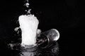 Water splash and crystal glass on black background Royalty Free Stock Photo