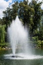 Water splash and drops near fountain in pond Royalty Free Stock Photo