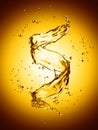Water splash in the form of spiral gold color Royalty Free Stock Photo