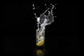 Water splash, lemon in the glass with water and ice cubes Isolated on Black Background Royalty Free Stock Photo