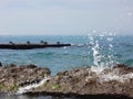 Water splash on rocks at sea beach