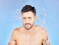 Water splash, shower and man cleaning, skincare and. washing body, face and beauty in blue stuck mockup background. Male