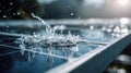 Water splashes on solar panel surface during rain creating droplets in sunlight at midday Royalty Free Stock Photo