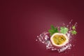 Water splashing on Fresh Passionfruit on red background