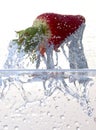 Water splashing on a strawberry