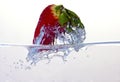 Water splashing on a strawberry