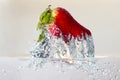 Water splashing on a strawberry