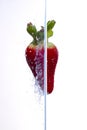 Water splashing on a strawberry