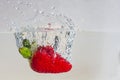 Water splashing on a strawberry