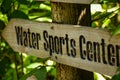 Water sports center wooden sign at the tropical island