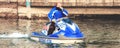 Water sports horizontal background of man on a blue ski jet watercraft in winter Royalty Free Stock Photo