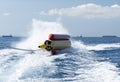 Water sports inflatable banana turned over during an extreme ride. Royalty Free Stock Photo