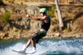 Water sports, wakeboard and surf with man in lake for training, summer break and travel vacation. Wave, adrenaline Royalty Free Stock Photo