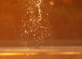 Water spray at sunset in summer. Royalty Free Stock Photo